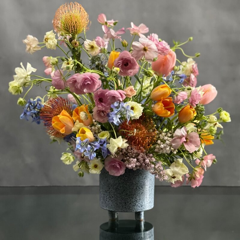 My Beverly Hills Florist presents same day delivery for our Airy and Positively fun arrangement. This includes a beautiful variety of colorful seasonal florals. This piece includes Tulips and Hyacinths.