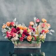 A beautiful presentation from our team at Beverly Hills Florist. A lovely creation of a  box of floral which includes, peach, pink and hot pink roses, dark pink hyacinths and a half bottle of Cote de Roses chardonnay. This gift is the ideal way to let someone know how much they mean to you. Love and Romance, Anniversary, Get Well