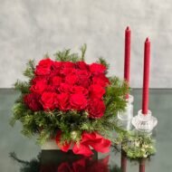 A Merry Little Christmas centerpiece with red roses, greenery, and gold ornaments, available for same-day delivery by Beverly Hills Florist.